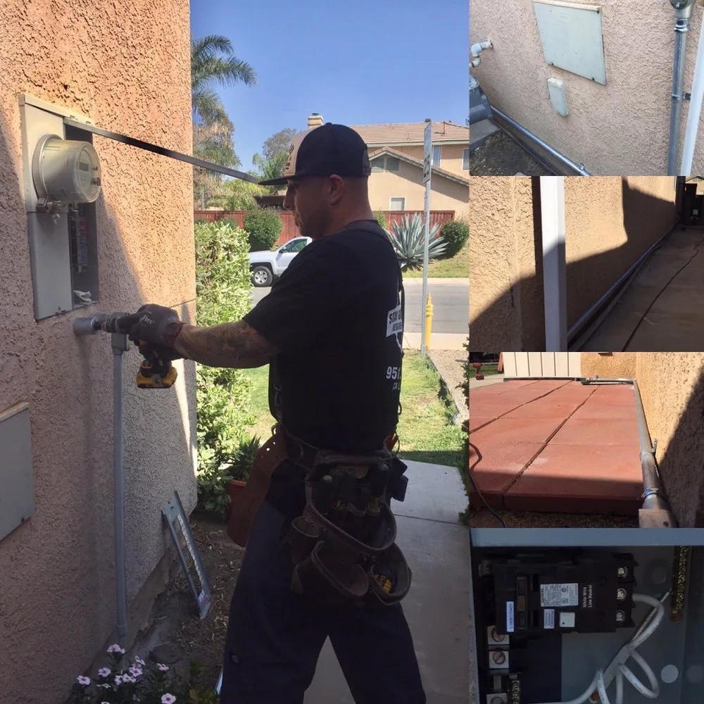 Electrician working at an exterior electrical panel